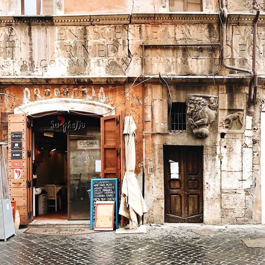 The entrance of Ba’Ghetto, a kosher restaurant on the main street of the Ghetto